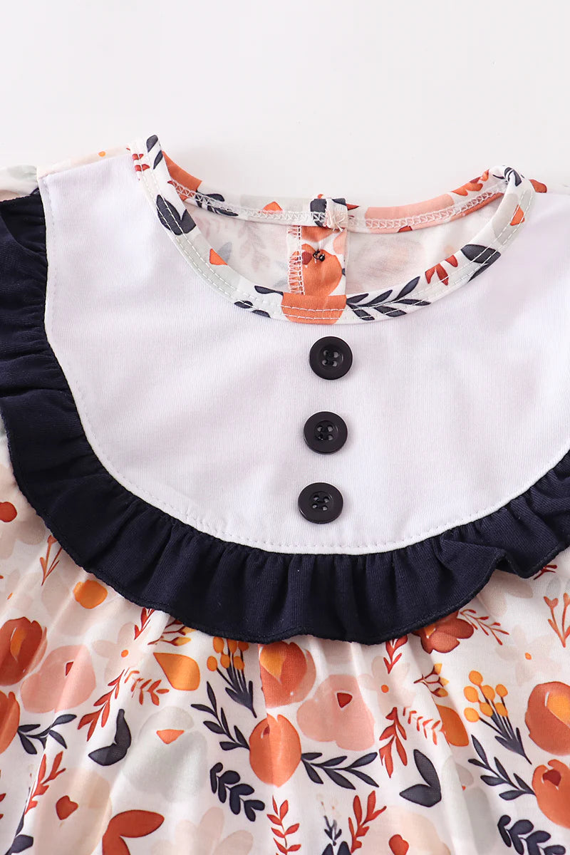 Navy floral ruffle romper