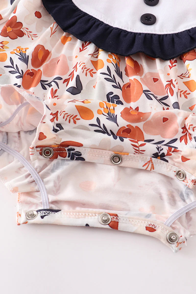 Navy floral ruffle romper